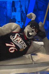a mascot wearing a jersey that says sixers