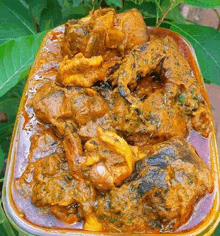 a close up of a casserole dish filled with a thick sauce and meat .