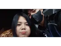 a man and a woman wearing face masks are posing for a photo