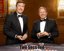 two men in tuxedos standing in front of a poker table with the words two secs ted written below them