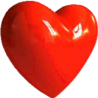 a large red heart is sitting on a white surface .