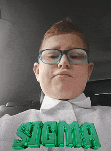 a boy wearing glasses and a white shirt with the name sigma written on it