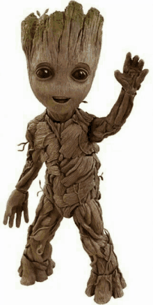 a figurine of groot from guardians of the galaxy is waving