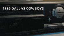 a close up of a dallas cowboys digital stereo player