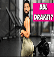 a man with a beard is standing in a gym next to a sign that says bbl drake