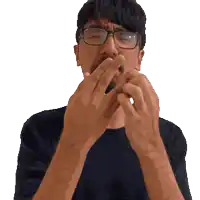 a man with glasses and a mustache is covering his mouth with his hands