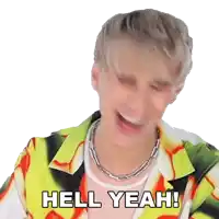 a man is laughing and saying hell yeah !