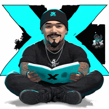 a man is sitting on the floor reading a book with a blue x in the background