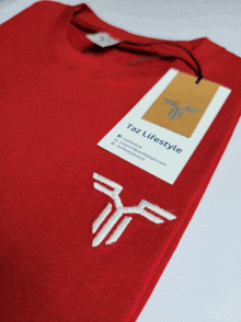 a red t-shirt with a tag that says taz lifestyle on it