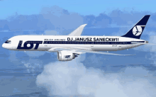 a polish airlines plane with dj janusz sanecki written on the side