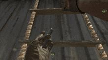 a screenshot of a video game shows a hand holding a weapon and a sign that says " defend "