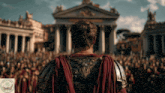 a man in armor stands in front of a crowd of people and a sign that says ' bible stories ' on it