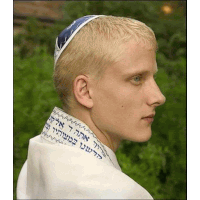 a young man wearing a blue headband with hebrew writing on the collar