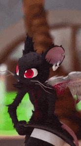 a black cat with red eyes is wearing a hat