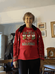 a woman wearing a red shirt that says santa when you have grandma