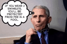 a man in a suit and tie is holding a pair of glasses in his mouth and talking about swimsuits .