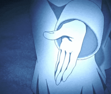 a close up of a person 's hand with a blue light shining on it