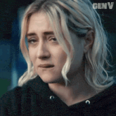 a close up of a woman 's face with the word genv on the bottom right