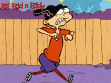 a cartoon character named ed n eddy is running in front of a fence