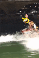 a person on a jet ski with a yellow bunny face on it