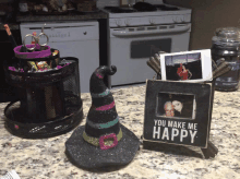 a sign that says you make me happy sits on a kitchen counter