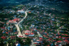 an aerial view of a small town with a watermark that says ' s.t.t. photography ' on it