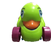 a green toy with pink wheels that looks like a bird