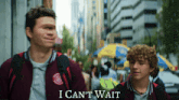 two boys walking down a street with the words i can 't wait