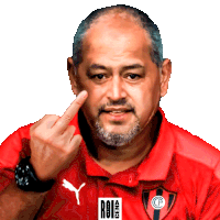 a man wearing a red polo shirt with a puma logo on it giving the middle finger