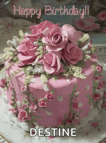 a pink birthday cake with pink roses and the name destine