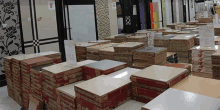 boxes of tiles are stacked on top of each other in a tile store