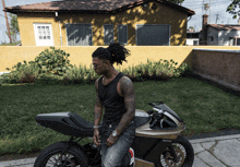 a man leans on a motorcycle that says ducati on the front