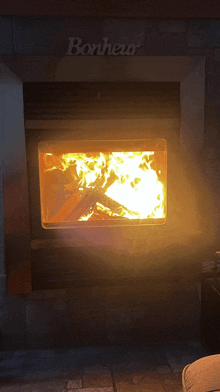 a fireplace with bonheur written on the top