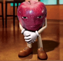 a cartoon apple with arms and legs is sitting on the floor with his eyes closed .