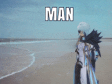 a man is standing on a beach with the word man behind him