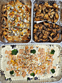 a tray of nachos chicken wings and a tray of broccoli cheese dip