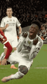 a soccer player is kneeling down on the field with his mouth open