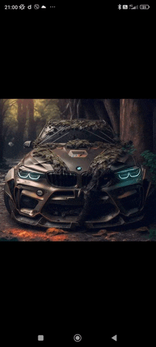 a bmw is sitting in the middle of a forest covered in moss