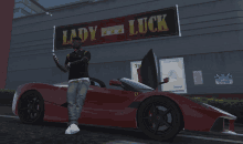 a man leans against a red sports car in front of a lady luck sign