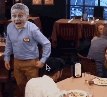 a man in a blue shirt is standing in a restaurant with a menu on the table in front of him