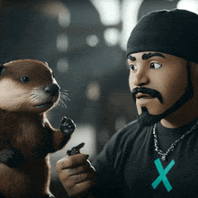 a man with a beard and a black shirt with an x on it talks to a stuffed animal