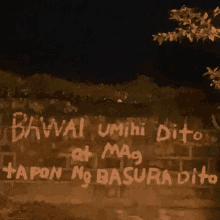 a brick wall with graffiti on it that says " bavval umihi dito "