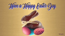 a picture of a chocolate bunny and eggs with the words have a happy easter day below it