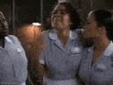 a group of maids are standing next to each other .