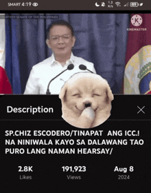 a screen shot of a man giving a speech with a dog behind him that says description