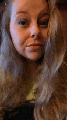 a close up of a woman 's face with long hair