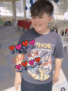 a boy wearing a thor love thunder shirt