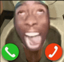 a man is sitting in a toilet talking on a cell phone with two green and red buttons .