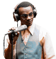 a man wearing headphones holds a microphone in his hand