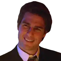 a man wearing a suit and tie is smiling